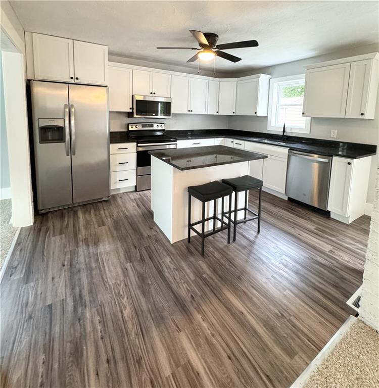 408 20th Street Beaver Falls, PA 15010 - Photo 7 of 27 a kitchen with wooden floors and appliances