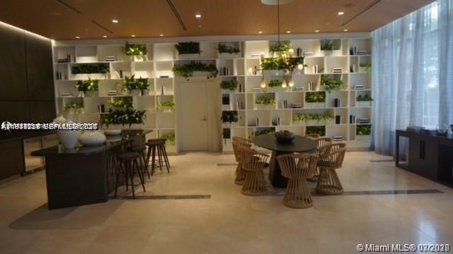 55 Southwest 9th Street, Unit 3307 Miami, FL 33130 - Photo 2 of 10 a view of a dining room with furniture