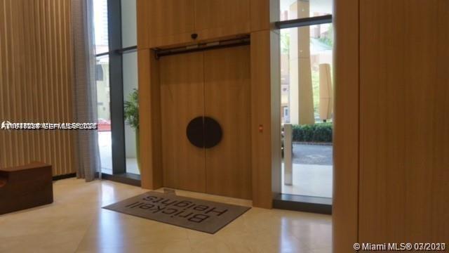 55 Southwest 9th Street, Unit 3307 Miami, FL 33130 - Photo 3 of 10 a bathroom with a tub and a shower