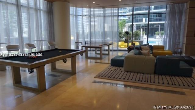 55 Southwest 9th Street, Unit 3307 Miami, FL 33130 - Photo 4 of 10 a living room with furniture and large windows