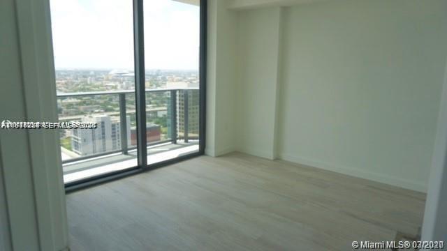 55 Southwest 9th Street, Unit 3307 Miami, FL 33130 - Photo 9 of 10 a view of empty room with floor to ceiling window