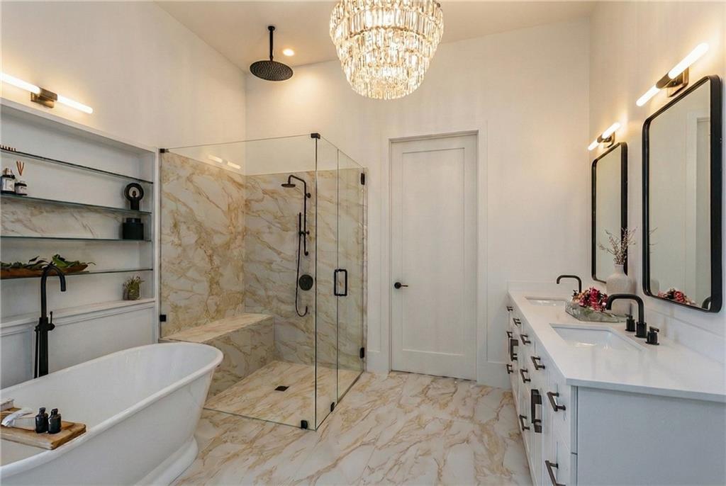 212 Lask Lane Milton, GA 30004 - Photo 9 of 42 a bathroom with a tub sink and mirror