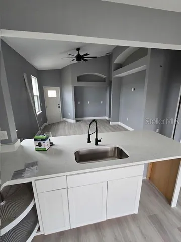 a kitchen with a sink and cabinets