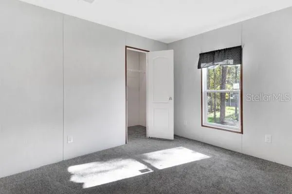 a view of an empty room and window