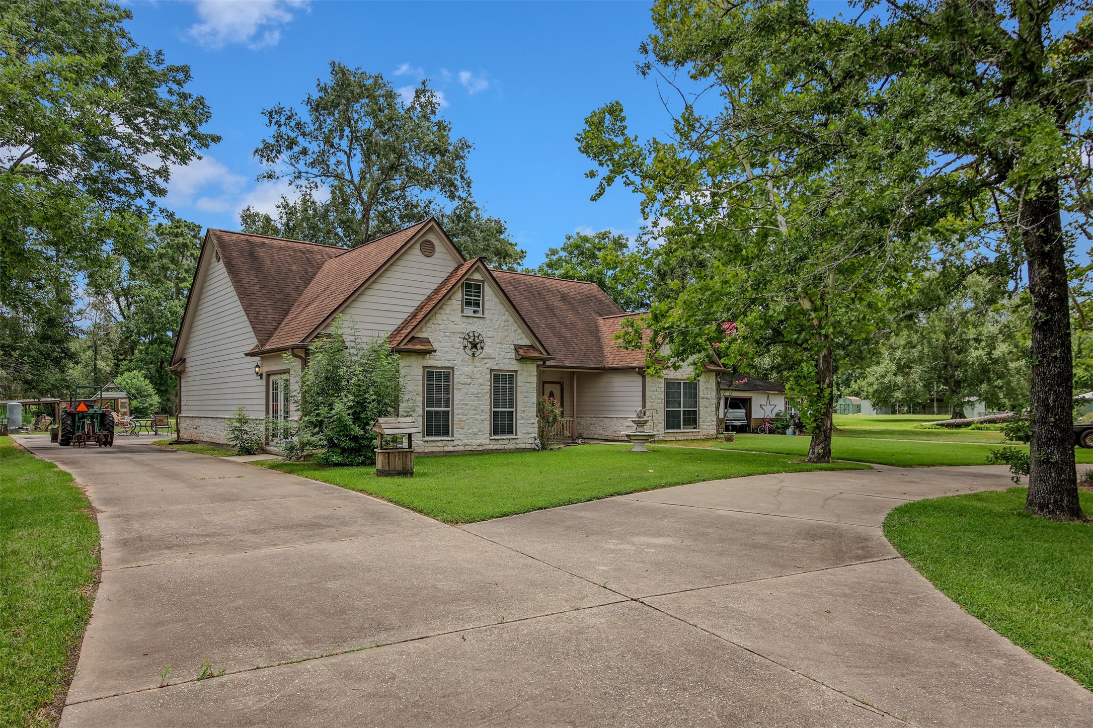 11692 Clark Lane Conroe, TX 77385 - Photo 33 of 35 This home features a large circle drive and extended driveway. It also has lots of mature trees and scenery.
