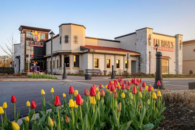 a sign board on the side of a street