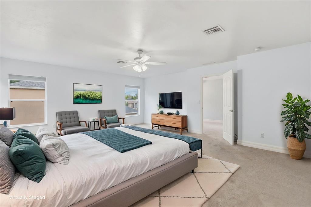 25134 Palisade Road Punta Gorda, FL 33983 - Photo 46 of 58 a bedroom with a bed and a flat screen tv