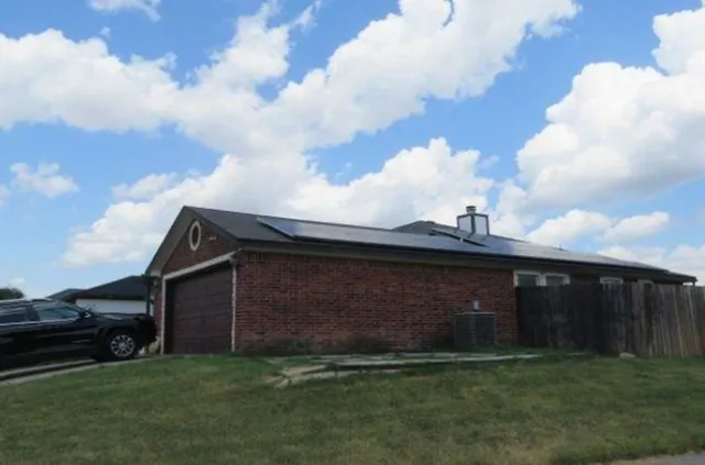 a view of a backyard of the house