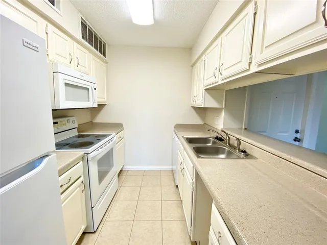 a kitchen with a stove and a microwave