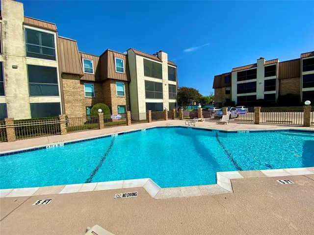 a front view of building with yard