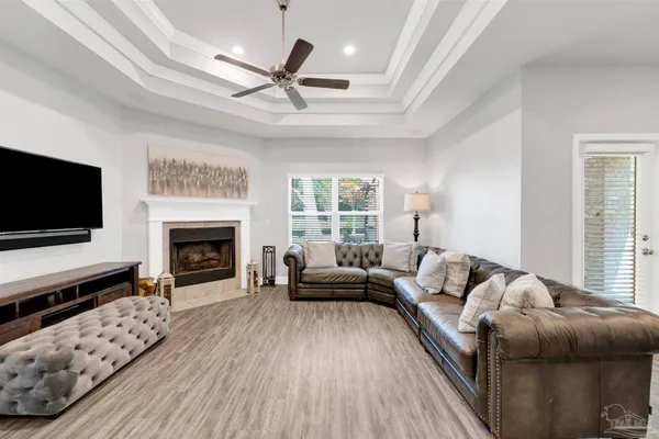 a living room with furniture fireplace and flat screen tv