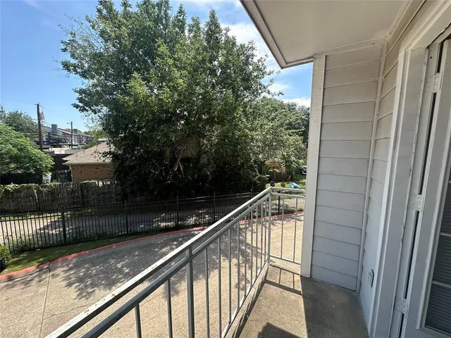 a view of balcony and front door