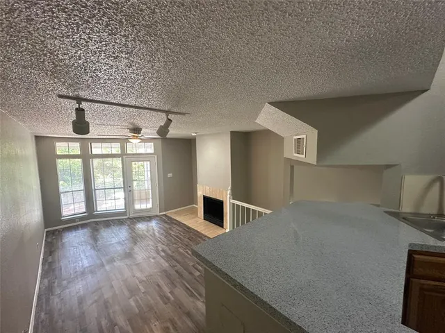 a kitchen with a stove sink and refrigerator