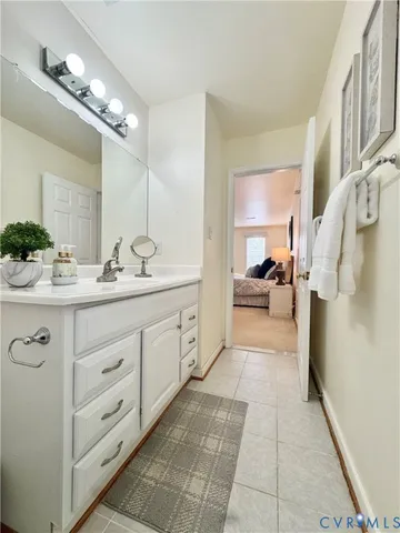 a spacious bathroom with a double vanity sink and a mirror