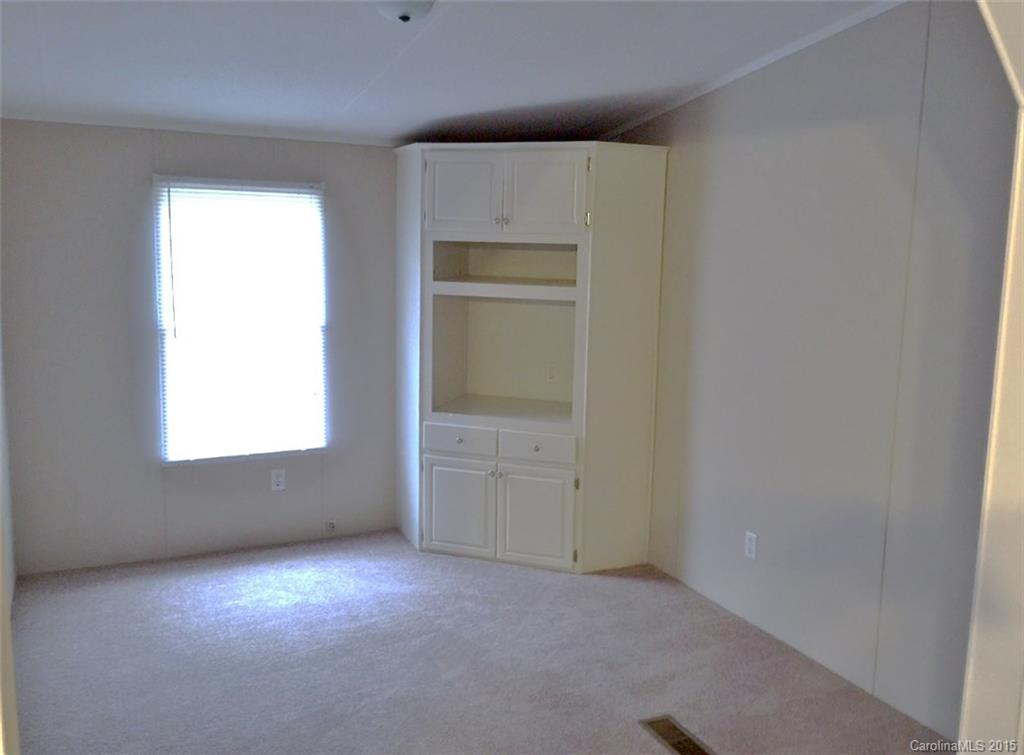 1915 Burkin Road McConnells, SC 29726 - Photo 11 of 16 an empty room with a window and cabinet