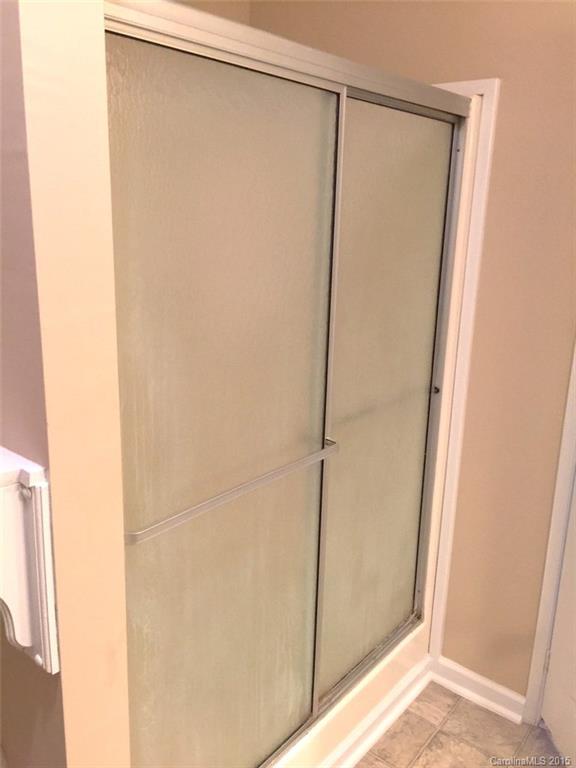 1915 Burkin Road McConnells, SC 29726 - Photo 12 of 16 a bathroom with a glass shower door