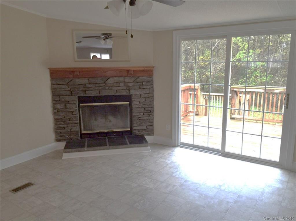 1915 Burkin Road McConnells, SC 29726 - Photo 5 of 16 a living room with furniture and a fireplace