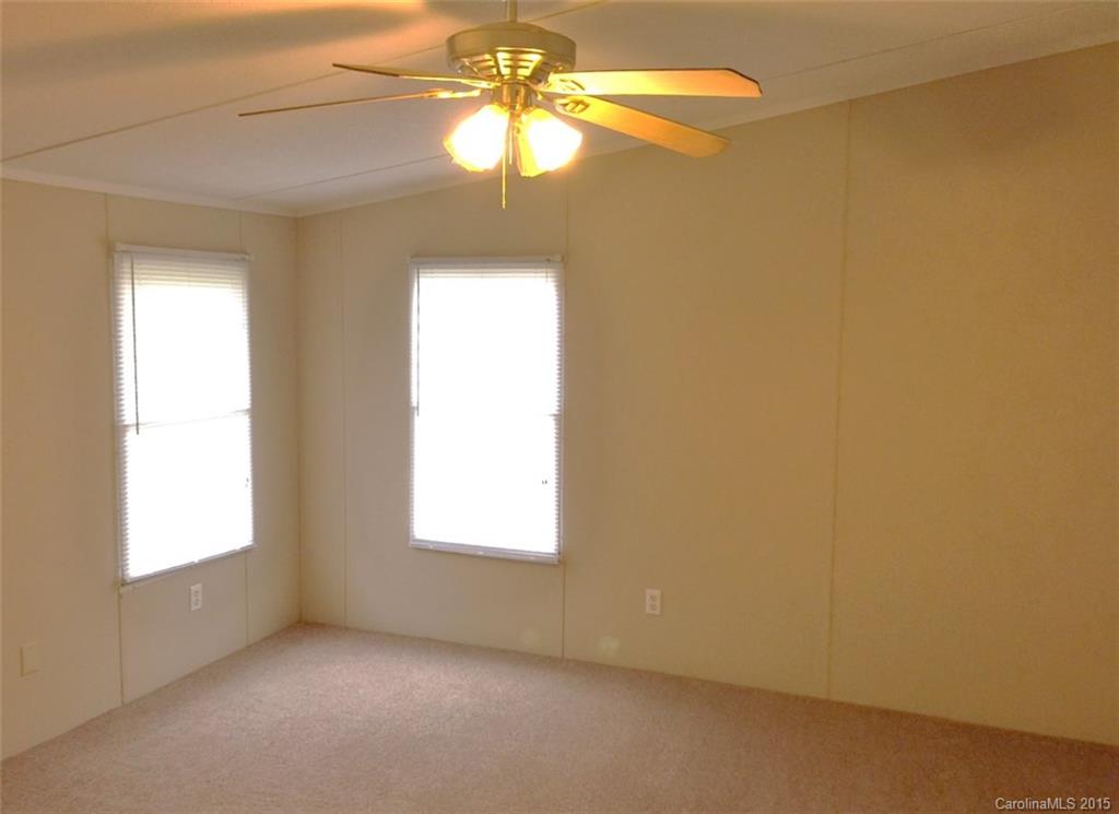 1915 Burkin Road McConnells, SC 29726 - Photo 10 of 16 an empty room with a window and a fan
