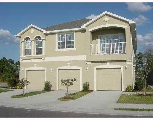 8890 Moonlit Meadows Loop Riverview, FL 33578 - Photo 1 of 1 a front view of a house with a yard and garage