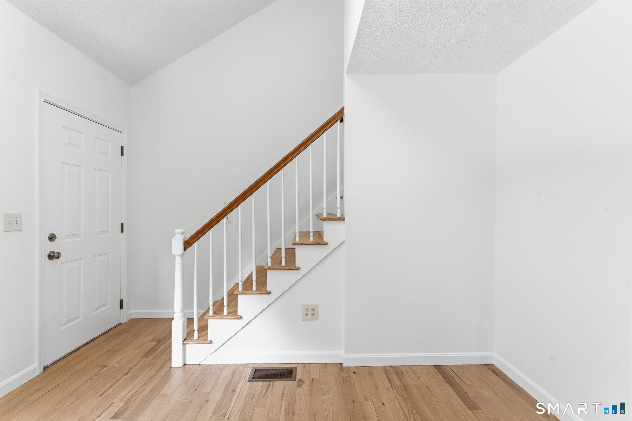 210 Springbrook Road Old Saybrook, CT 06475 - Photo 19 of 32 Stairs leading upstairs to 2 bedrooms, full bathroom, and a walk-in hallway closet.