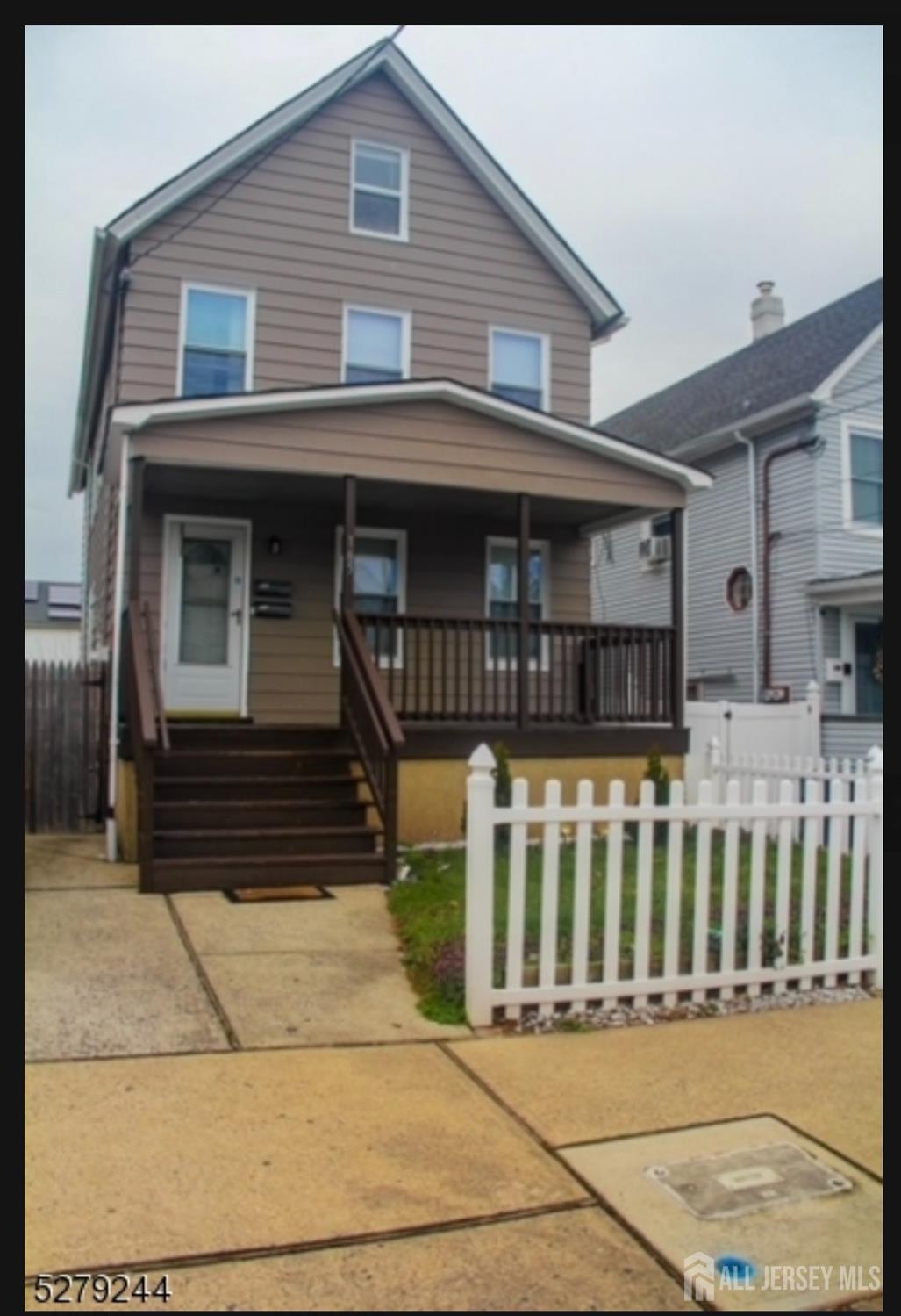 165 Emerson Street, Unit 2 Carteret, NJ 07008 - Photo 1 of 10 a front view of a house with large windows