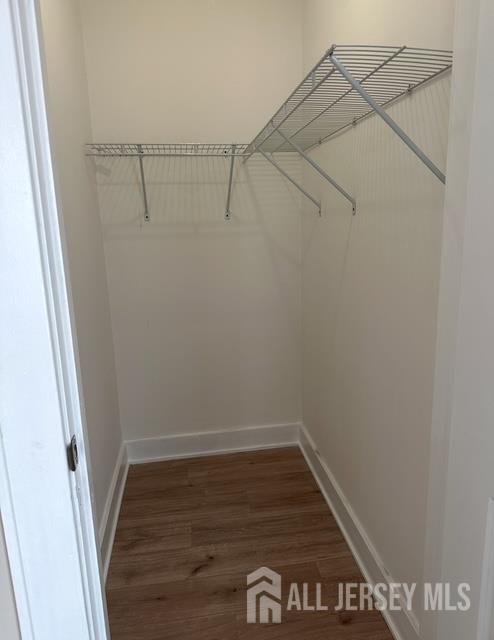 165 Emerson Street, Unit 2 Carteret, NJ 07008 - Photo 9 of 10 a view of a room with racks on the wall
