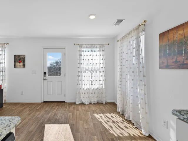 a view of empty room with windows