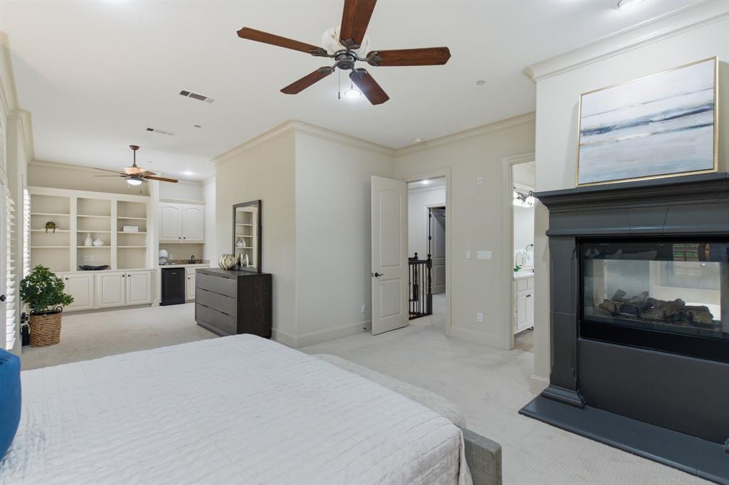 30 Piazza Lane Colleyville, TX 76034 - Photo 18 of 39 Primary offers a cozy fireplace with a lovely sitting or work area
