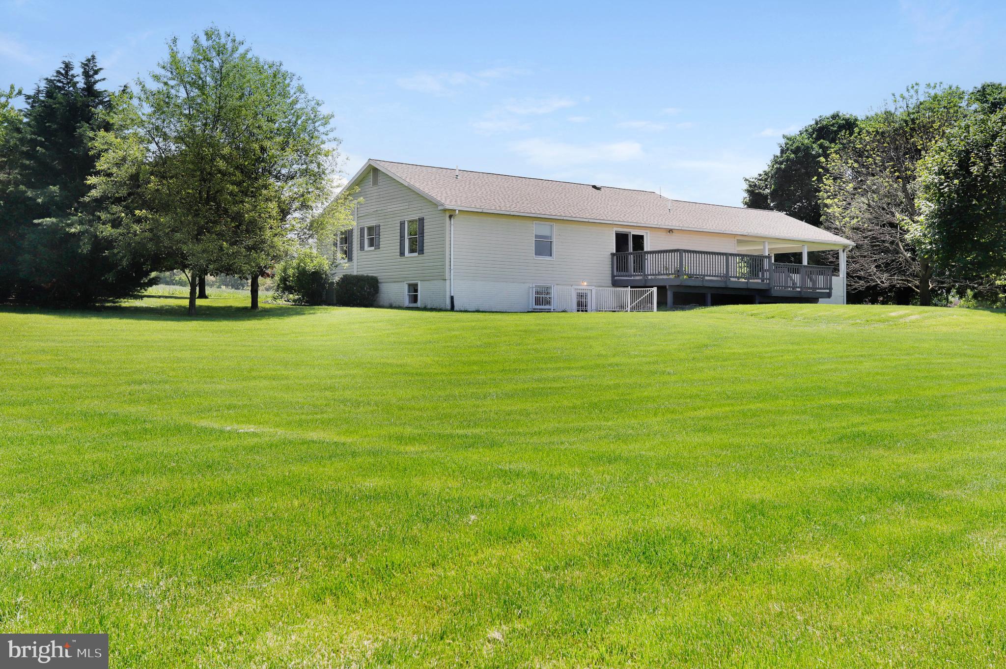 Large flat .61 acre lot...spacious yet manageable!