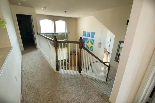 a view of entryway and hall with wooden floor
