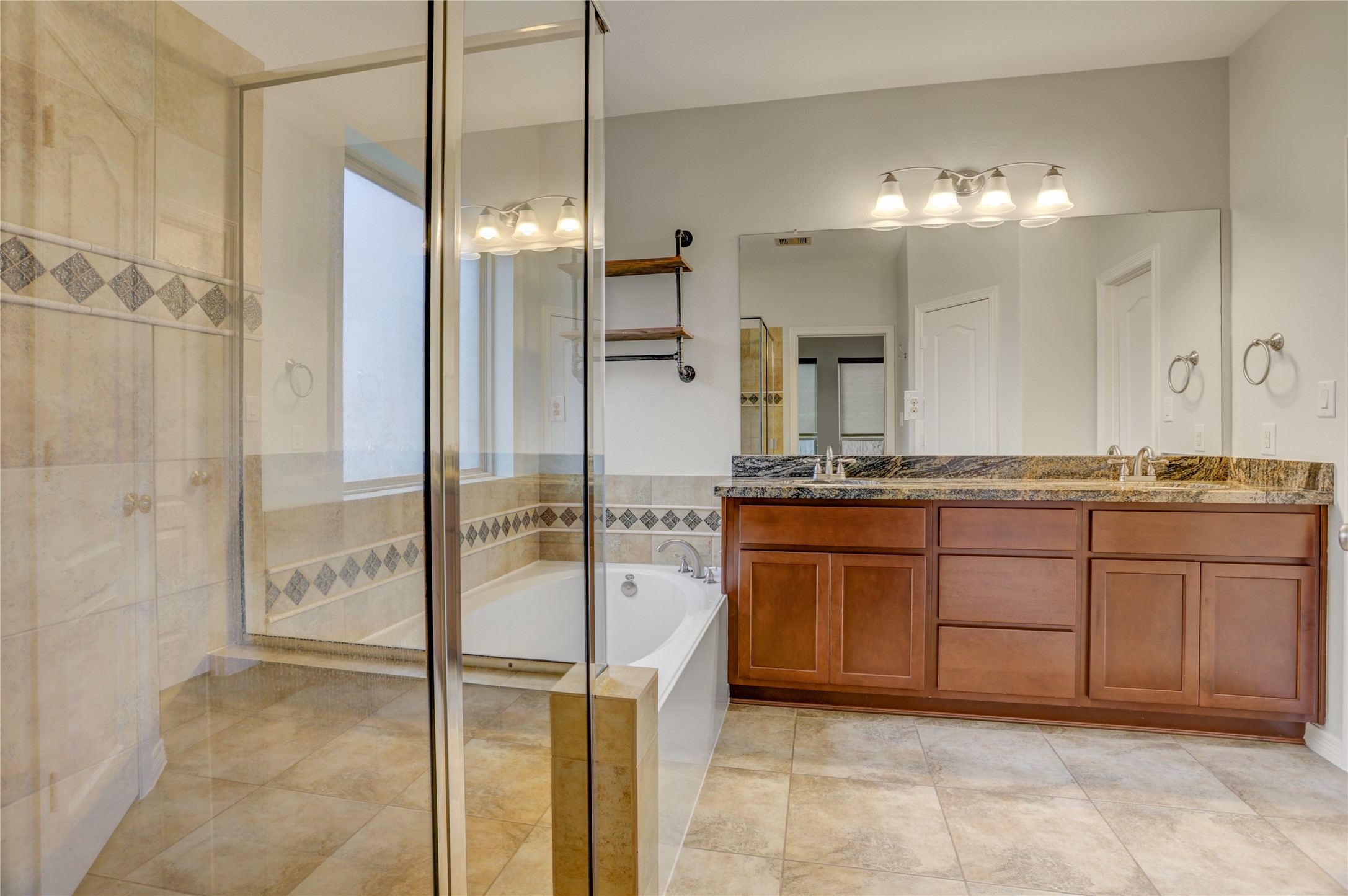 3002 Currant Drive Manvel, TX 77578 - Photo 22 of 43 a bathroom with a granite countertop sink and a mirror