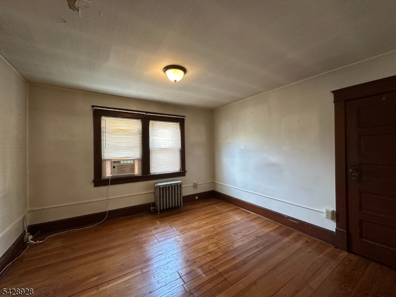 13 Cemetery Road Great Meadows, NJ 07838 - Photo 12 of 20 an empty room with wooden floor and windows