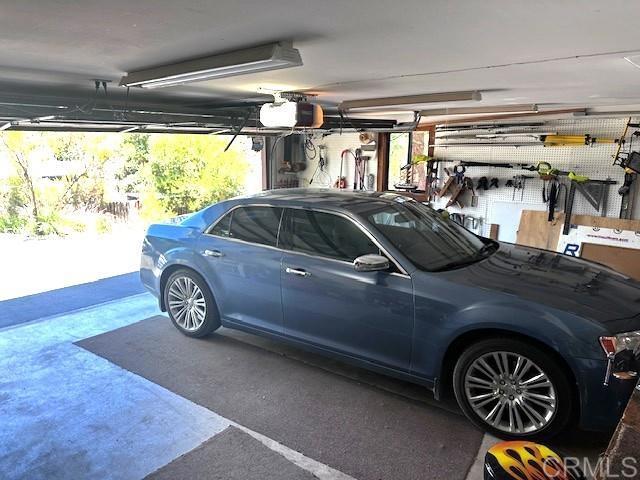12993 Old Barona Road Lakeside, CA 92040 - Photo 23 of 48 a car parked in a garage