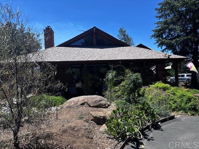 12993 Old Barona Road Lakeside, CA 92040 - Photo 26 of 48 a front view of a house with a yard