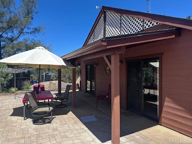 12993 Old Barona Road Lakeside, CA 92040 - Photo 42 of 48 a view of a chairs and tables in patio