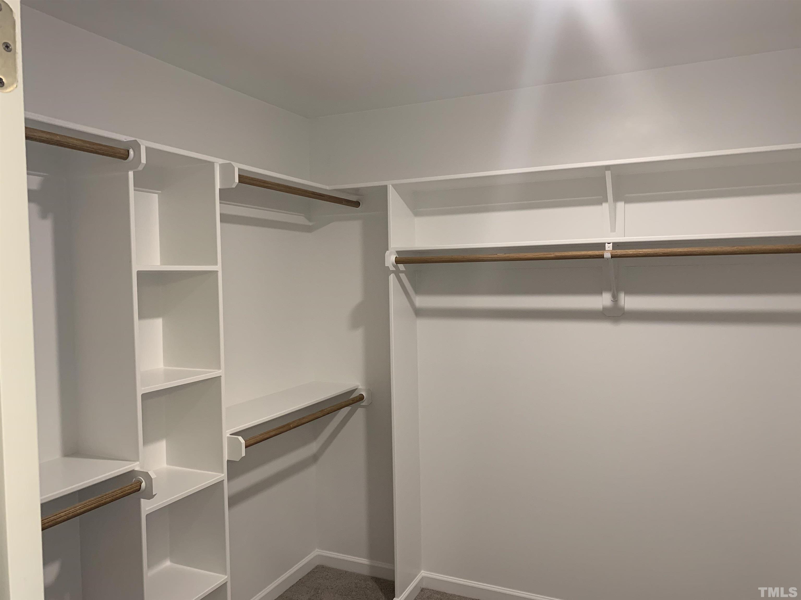 32 Daffodil Garden Court Smithfield, NC 27577 - Photo 11 of 19 a view of an empty walk in closet