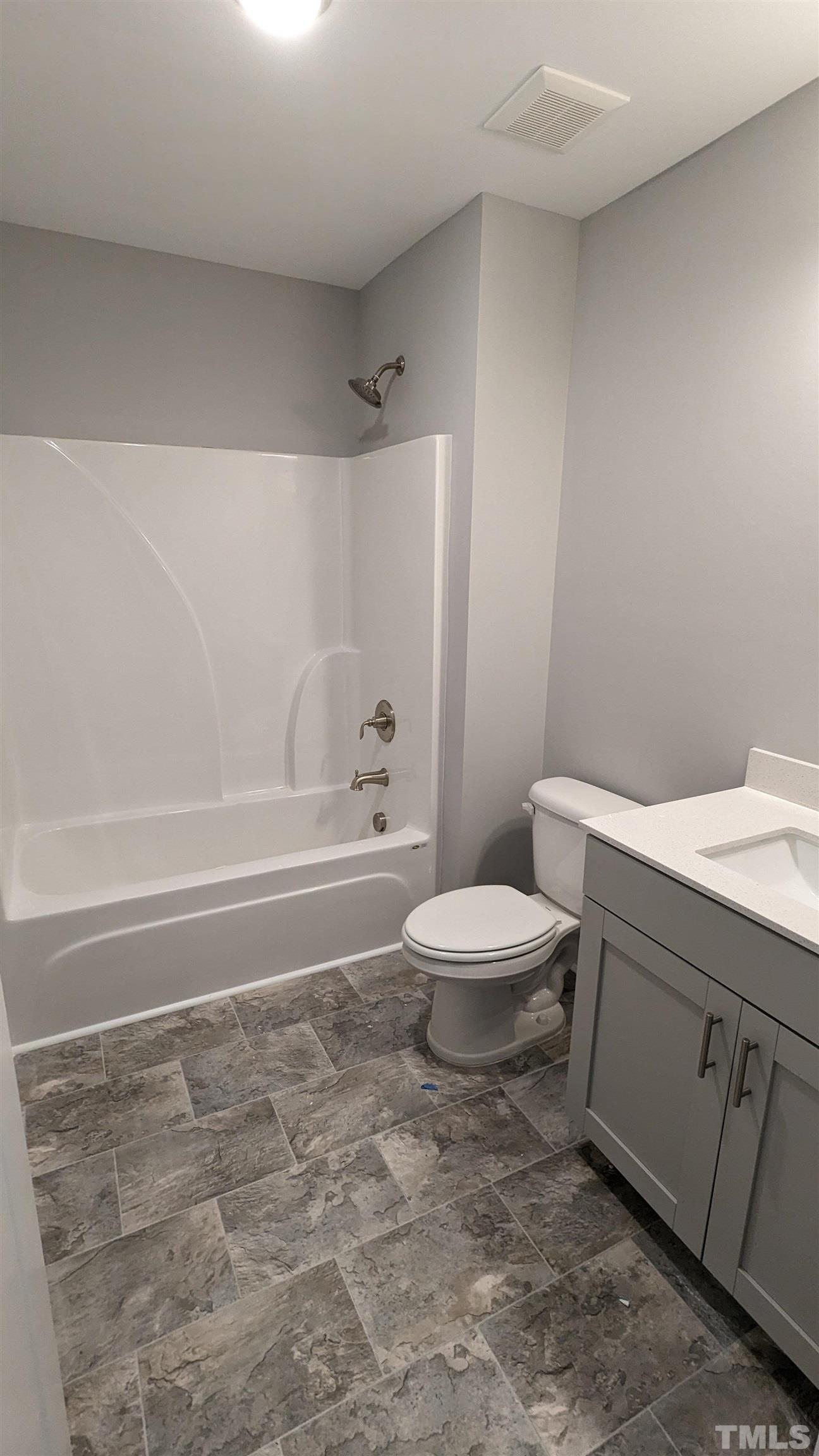 32 Daffodil Garden Court Smithfield, NC 27577 - Photo 13 of 19 a bathroom with a toilet and a shower