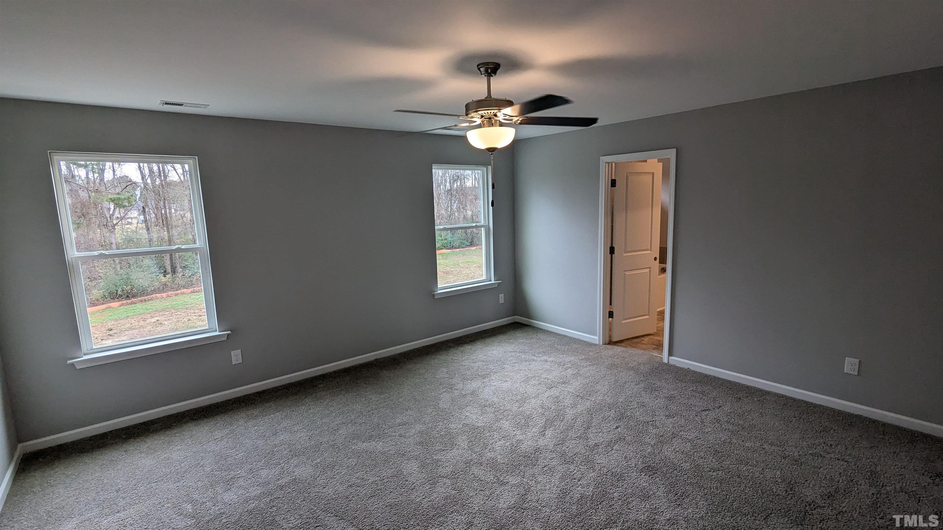 32 Daffodil Garden Court Smithfield, NC 27577 - Photo 9 of 19 a view of an empty room with a window