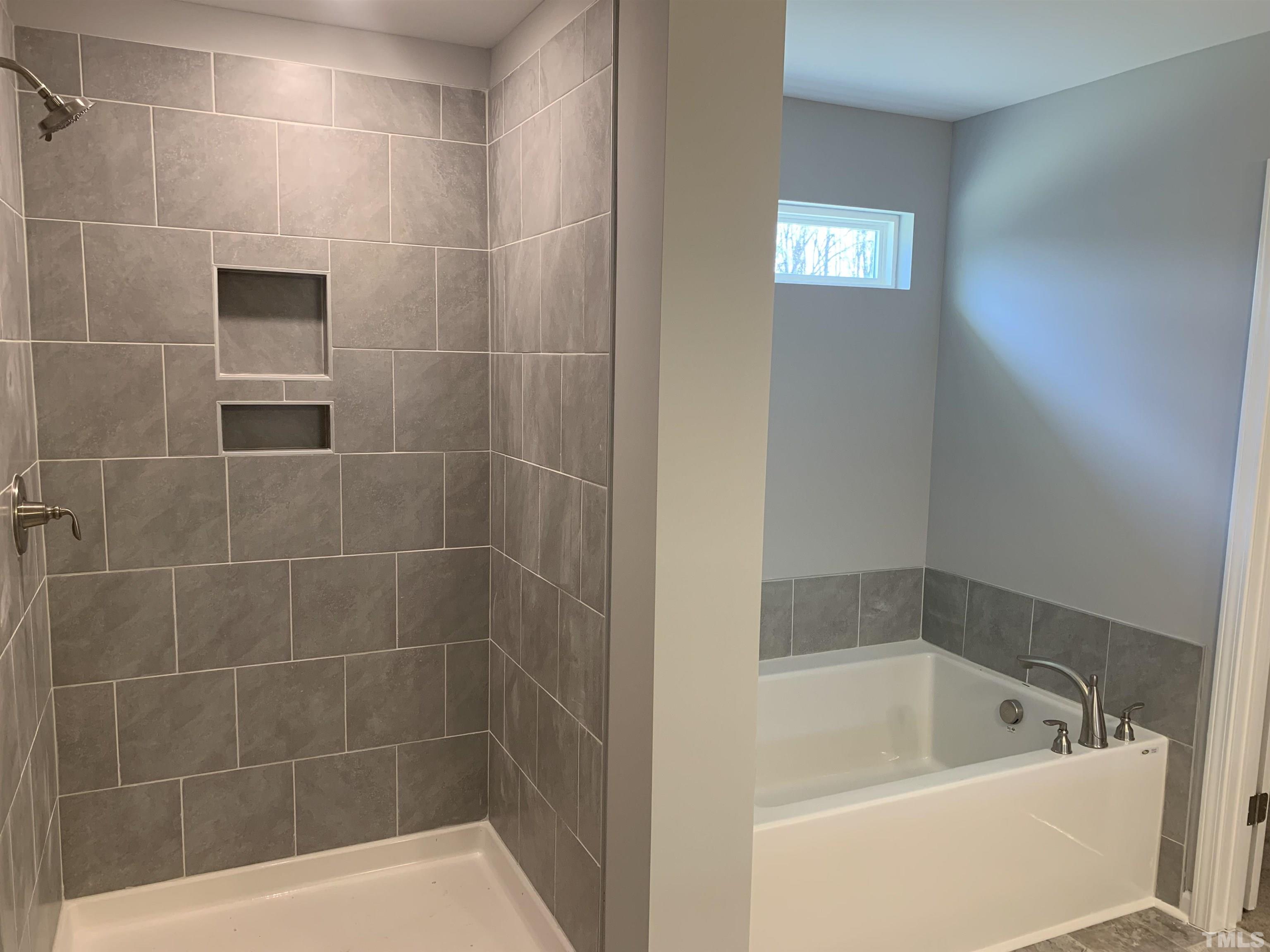 32 Daffodil Garden Court Smithfield, NC 27577 - Photo 10 of 19 a bath tub sitting next to a shower