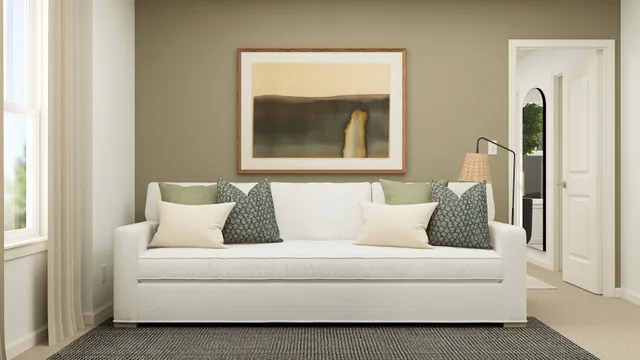 a living room with a couch and a window