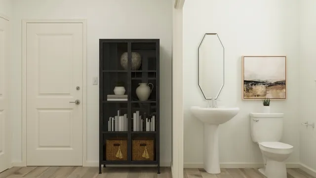 a bathroom with a toilet a sink and mirror