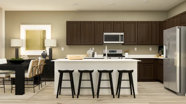 a kitchen with a table chairs refrigerator and cabinets