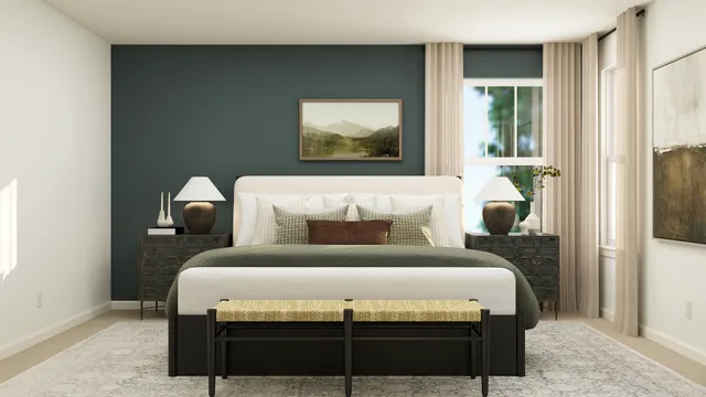 a bedroom with a bed and a painting on the wall