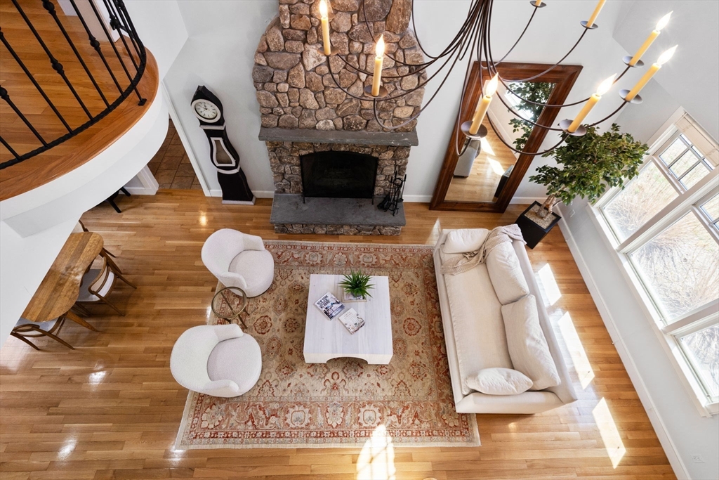 45 Sherman's Bridge Road Wayland, MA 01778 - Photo 15 of 20 a living room with furniture and a fireplace