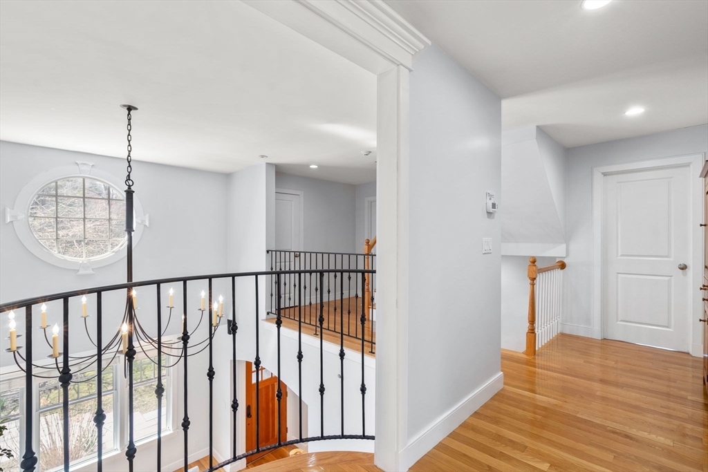 45 Sherman's Bridge Road Wayland, MA 01778 - Photo 16 of 20 a view of hallway with wooden floor