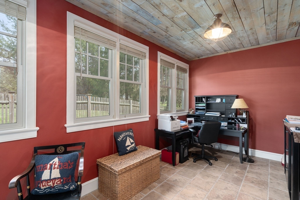 45 Sherman's Bridge Road Wayland, MA 01778 - Photo 17 of 20 a view of a workspace with furniture and a window