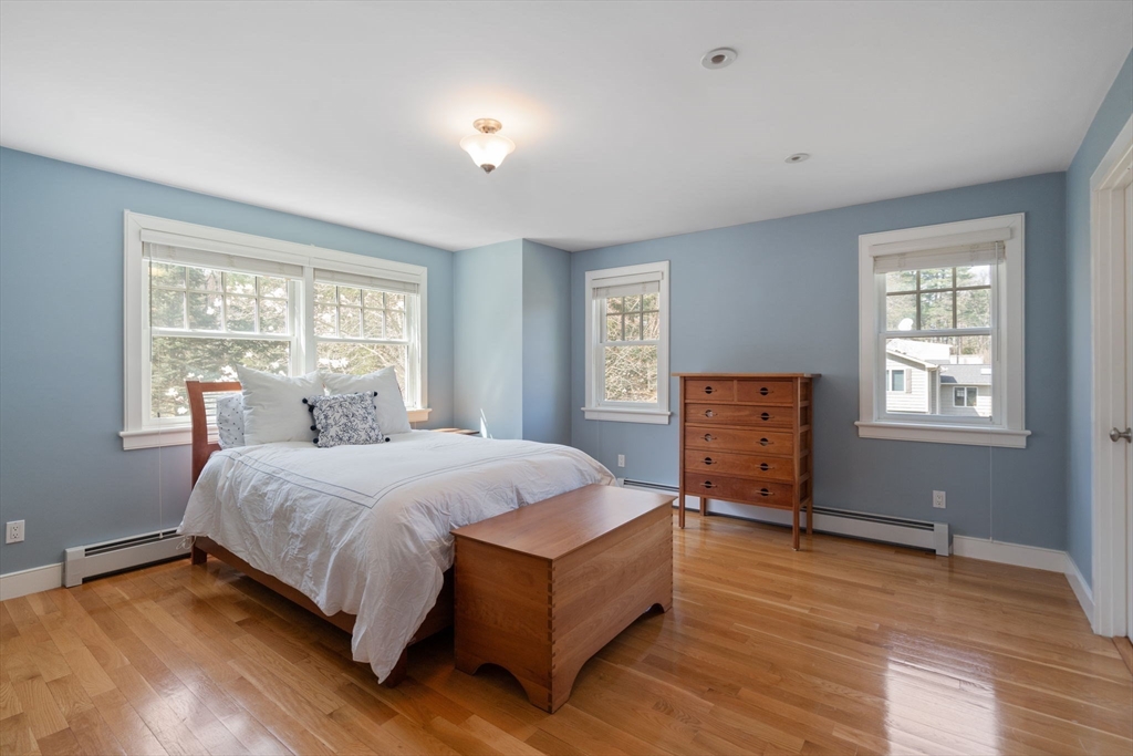 45 Sherman's Bridge Road Wayland, MA 01778 - Photo 19 of 20 a spacious bedroom with a bed and window