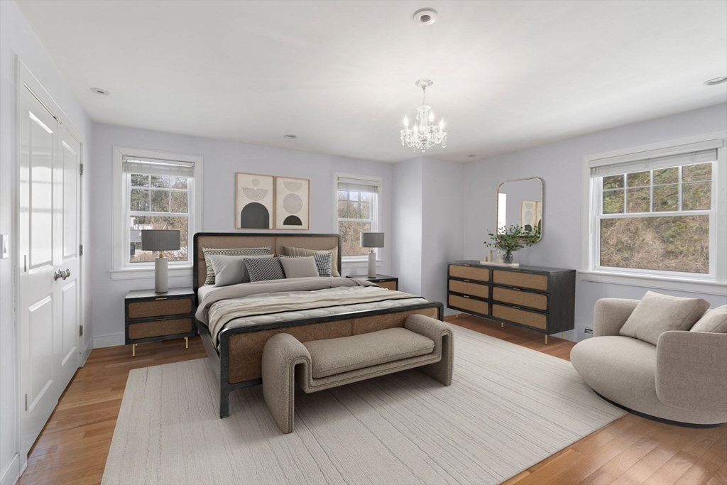 45 Sherman's Bridge Road Wayland, MA 01778 - Photo 20 of 20 a spacious bedroom with a bed and wooden floor