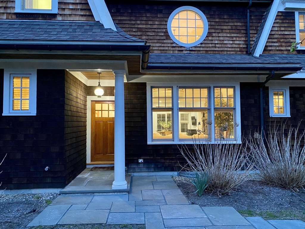 45 Sherman's Bridge Road Wayland, MA 01778 - Photo 3 of 20 a view of entrance with a wooden door