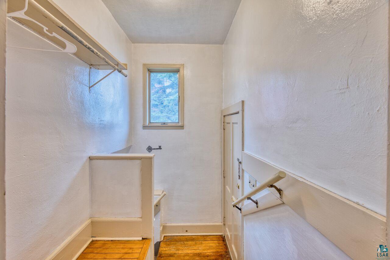 4191 Kerr Location Hibbing, MN 55746 - Photo 12 of 37 Staircase featuring baseboards